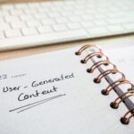 Notebook with user-generated content note and keyboard, ideal for planning and productivity.